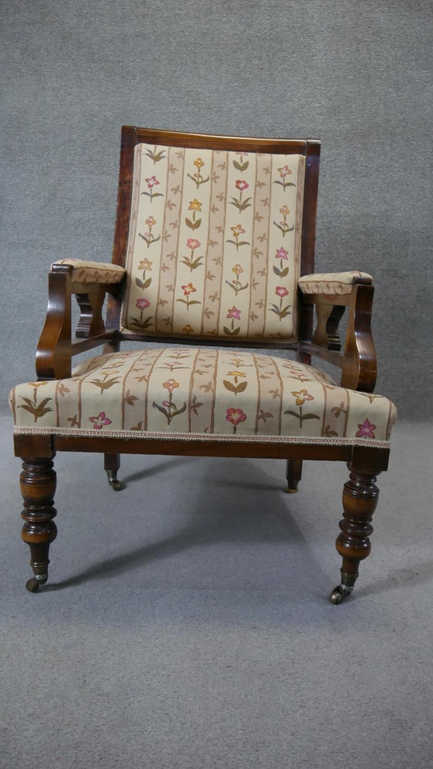 A late 19th century walnut framed armchair in floral upholstery on turned tapering supports. - Image 5 of 7