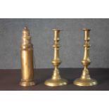 A pair of early 20th century brass candlesticks along with a portable brass candlestick lantern with