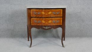 A small Louis XV style walnut and satinwood inlaid marble topped commode with ormolu mounts on