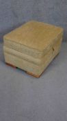 A contemporary upholstered lidded ottoman footstool. H.43 W.67 D.56cm