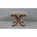 A 19th century mahogany stool on X frame swept supports. H.43 W.44 D.46cm