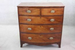 A Georgian mahogany bow fronted chest of drawers on swept bracket feet. H.144 W. 100 D. 52 cm.