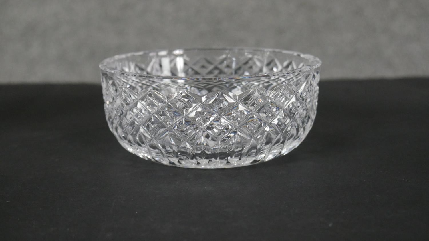 A collection of eight cut crystal pieces. Including a boat shaped crystal bowl, a lidded cut crystal - Image 5 of 6