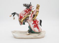 A hand painted porcelain figure of Robert the Bruce by Michael Sutty. (damaged) H.27 W.27cm