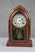 A late 19th century mahogany eight day cathedral mantle clock by Waterbury Corinth, USA. The glass