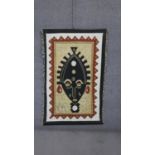 An tribal mask wall hanging on canvas with wooden poles. H.140 W.90