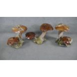 A collection of three pieces of scrap wood garden ornamentation carved as mushrooms. H.50 W.48 D.