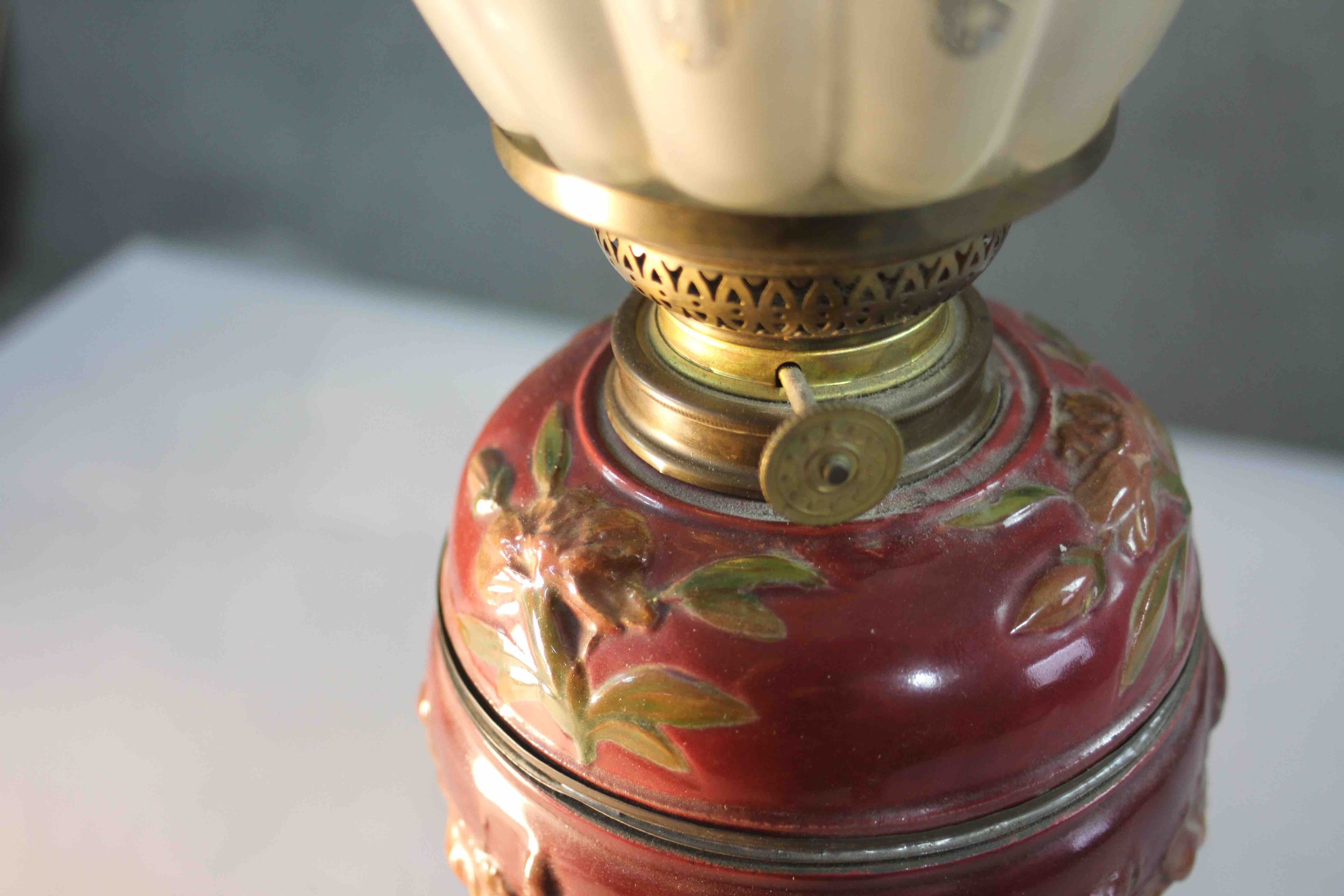 A Victorian relief ceramic and repousse brass rose design oil lamp. With etched tear drop shaped - Image 5 of 6