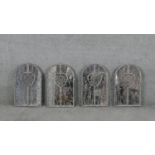 A set of four arched garden mirrors in distressed painted wrought metal frames. H.50 W.31cm