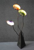 A vintage coloured glass table lamp in the form of a stylised flowering plant. With three light up