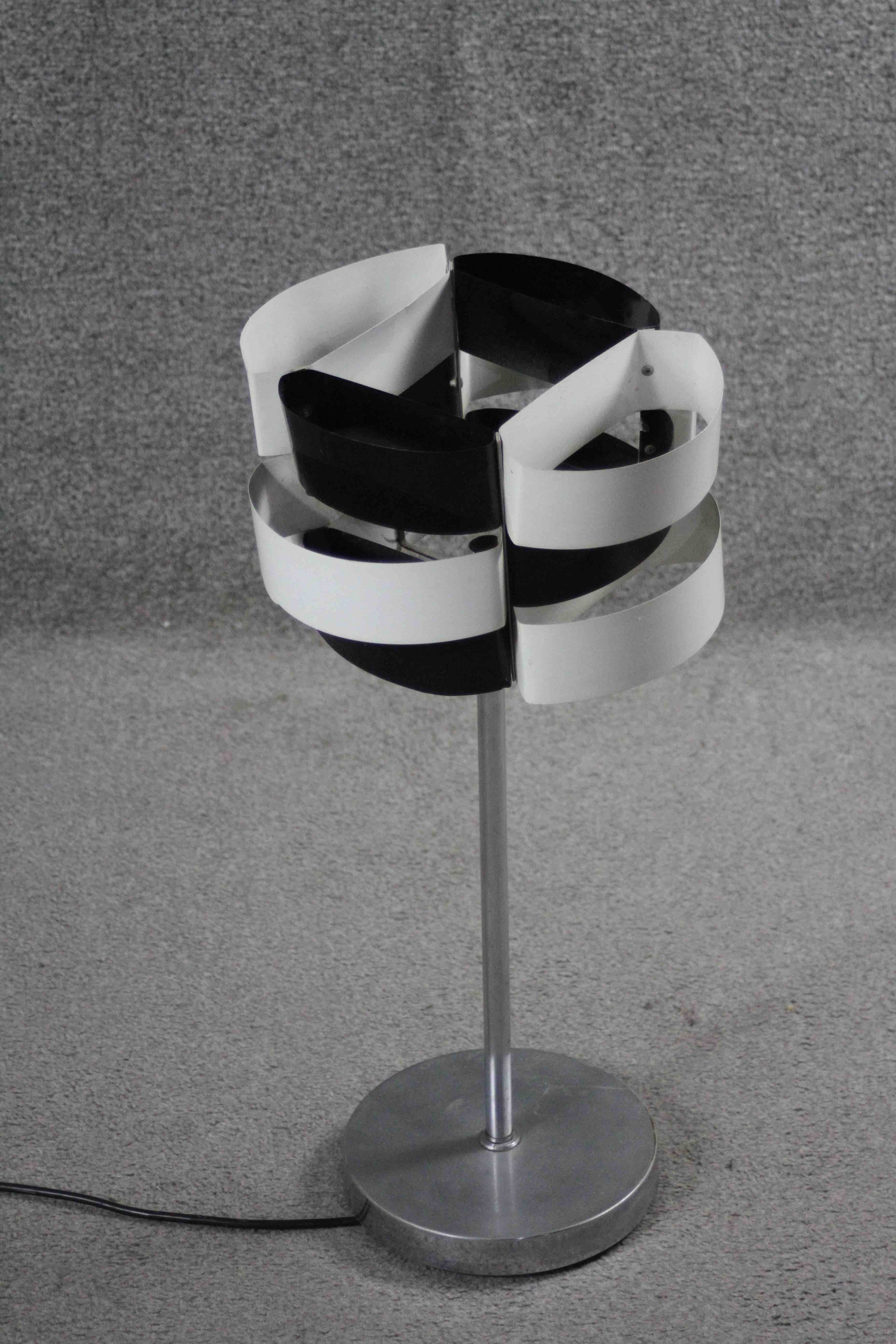 A vintage black and white metal strip abstract design table lamp on brushed chrome stand. H.60 W.