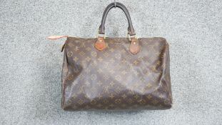 A vintage Louis Vuitton monogram Speedy 30 handbag, the maker's monogram coated canvas with smooth