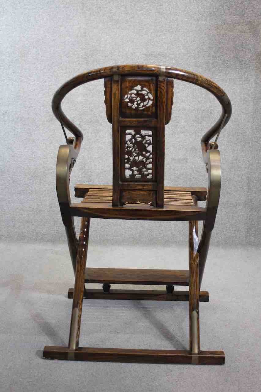 A Chinese huali folding scribes armchair with hooped back and intricately carved back splat and - Image 3 of 10