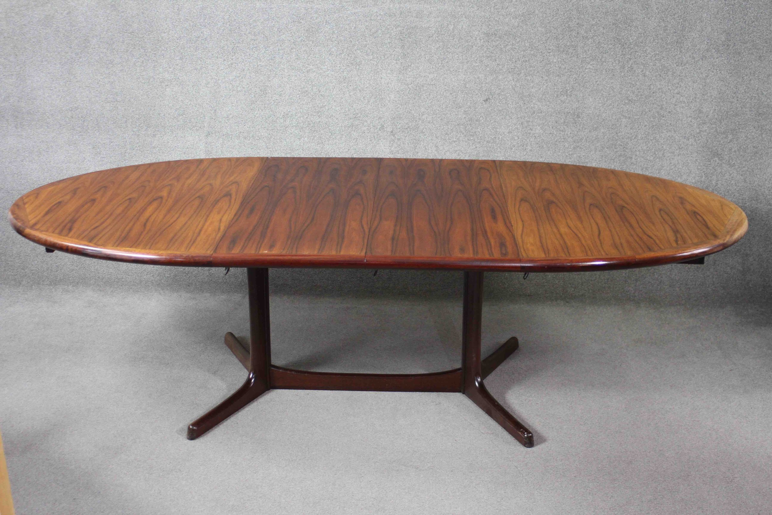 A vintage Danish dining table by Dyrland with two extra leaves and maker's label to the underside. - Image 3 of 7