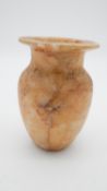 A carved alabaster Egyptian style offering vessel with wide rim. H.13 Dia. 9cm