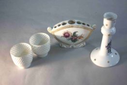 A collection of four pieces of porcelain. Including a gilded floral design flower vase, a Royal