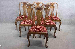 A set of six mid century burr walnut Epstein dining chairs with shaped vase splats above drop in