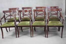 A set of eight mahogany Regency style bar back dining chairs with drop in seats on reeded sabre