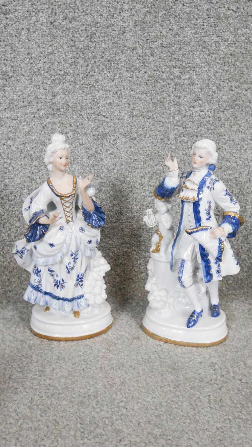 A collection of 12 blue and white gilded porcelain figures. Including a Coalport miniature cottage - Image 3 of 7