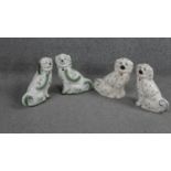 Two pairs of Staffordshire style ceramic spaniels. One pair with Blakeney stamp to bases. H.21 W.