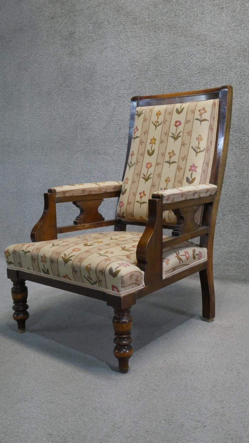 A late 19th century walnut framed armchair in floral upholstery on turned tapering supports. - Image 3 of 7