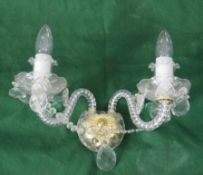 An early 20th century cut crystal and twisted cane glass two branch wall light with brass fittings