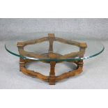 A Continental style walnut coffee table with plate glass top. H.43 W.130 D.80