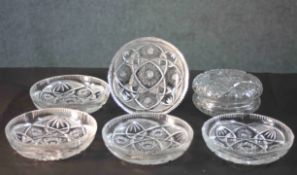A set of five heavy hand cut crystal bowls with a stylised foliate and star design along with a