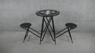 A folding metal garden or conservatory table with integral twin stools and Fleur de Lys