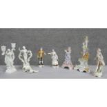 A collection of hand painted porcelain figures. Including two Capodimonte figurines, one of a male