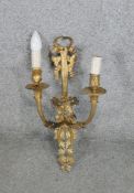 A Victorian gilt metal two branch foliate and bow design wall sconce. L.52 CM