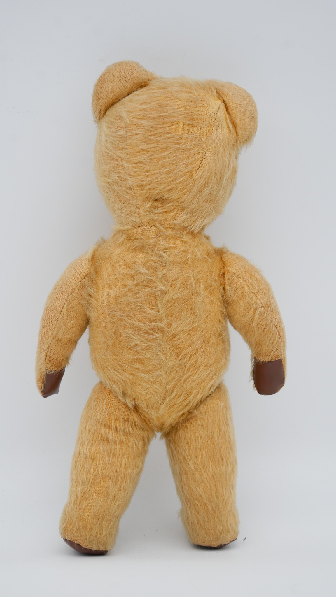 An antique yellow growler teddy bear with glass eyes and leather pads. - Image 3 of 5