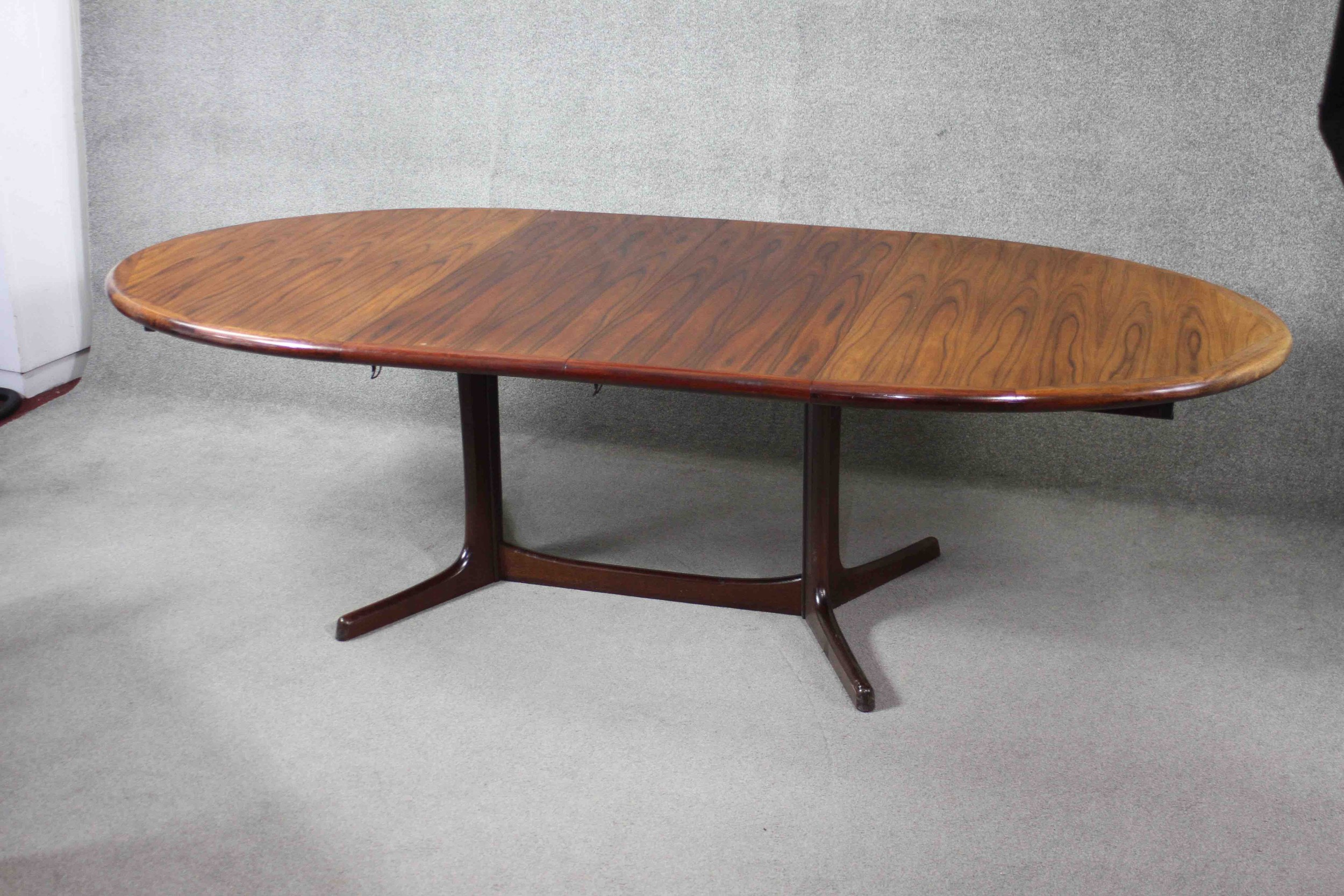 A vintage Danish dining table by Dyrland with two extra leaves and maker's label to the underside. - Image 4 of 7