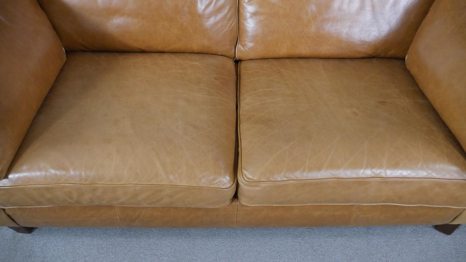 An Art Deco style two seater sofa in light tan leather upholstery. H.84 W.179 D.97cm - Image 2 of 5