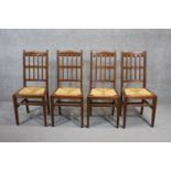 A set of four late 19th century mahogany dining chairs with drop in woven rush seats on square