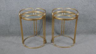 A pair of Art Deco style gilt metal mirror topped occasional tables. H.53 Diam.40cm