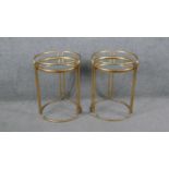 A pair of Art Deco style gilt metal mirror topped occasional tables. H.53 Diam.40cm