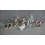 A collection of eight hand painted porcelain figures. Including a Lladro figurine of a shepherd