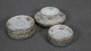 A collection of fine bone china saucers and plates along with a sugar bowl all hand painted with a