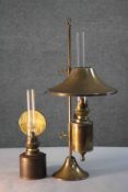 Two brass oil lamps. One Kosmos Brenner brass oil table lamp with conical brass shade, glass