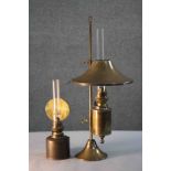 Two brass oil lamps. One Kosmos Brenner brass oil table lamp with conical brass shade, glass