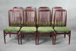 A set of eight vintage dining chairs by Benny Linden with splat backs raised on shaped stretchered