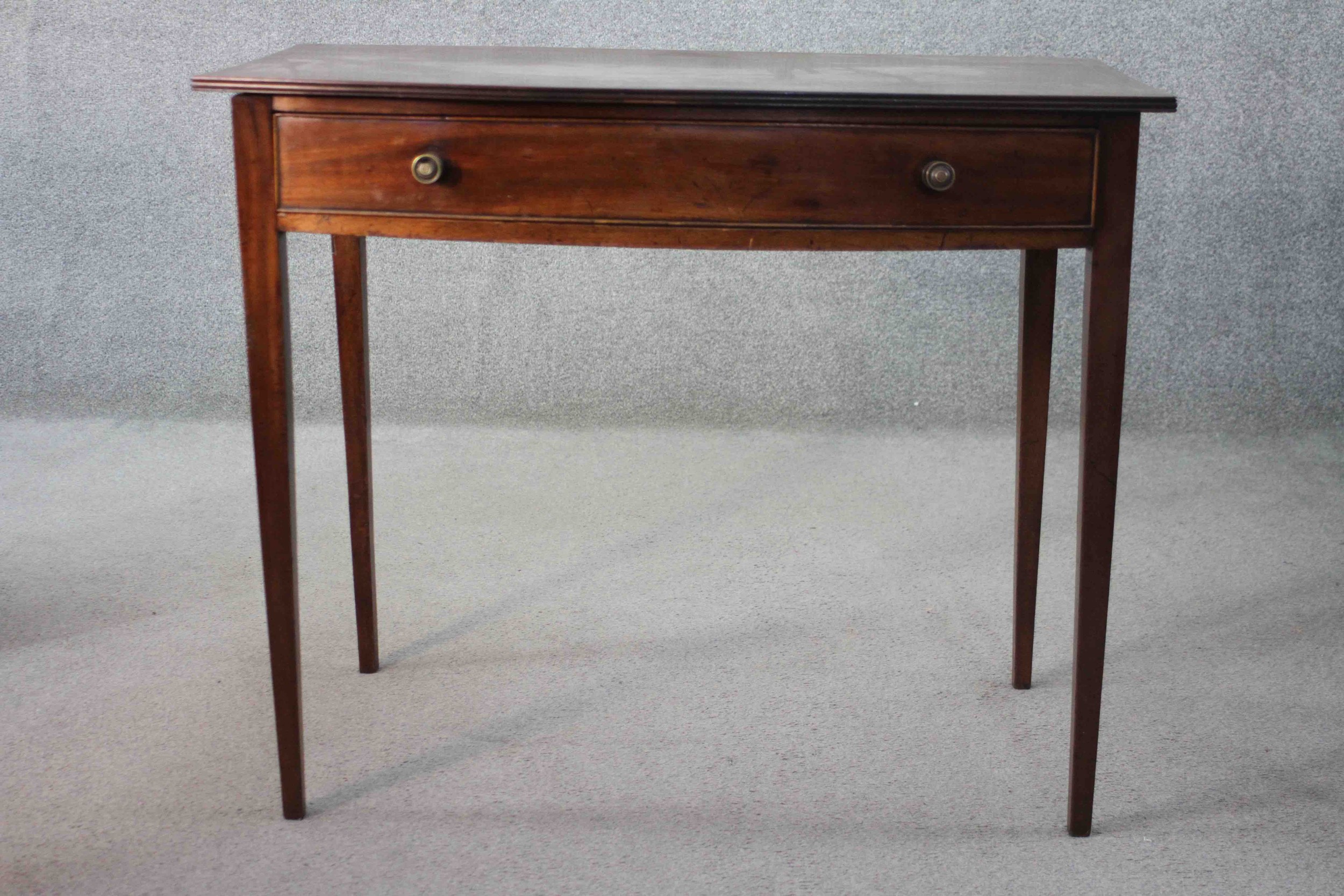 A 19th century mahogany and satinwood strung bow fronted side table on square tapering supports. H.