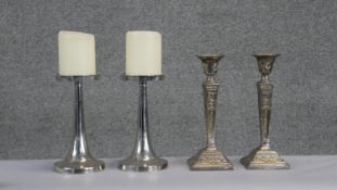 Two pairs of silver plated candlesticks. Including a pair of Victorian square based candlesticks