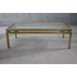 A vintage Maison Jansen style plate glass and brass low coffee table. H.34 W.106 D.55 cm.