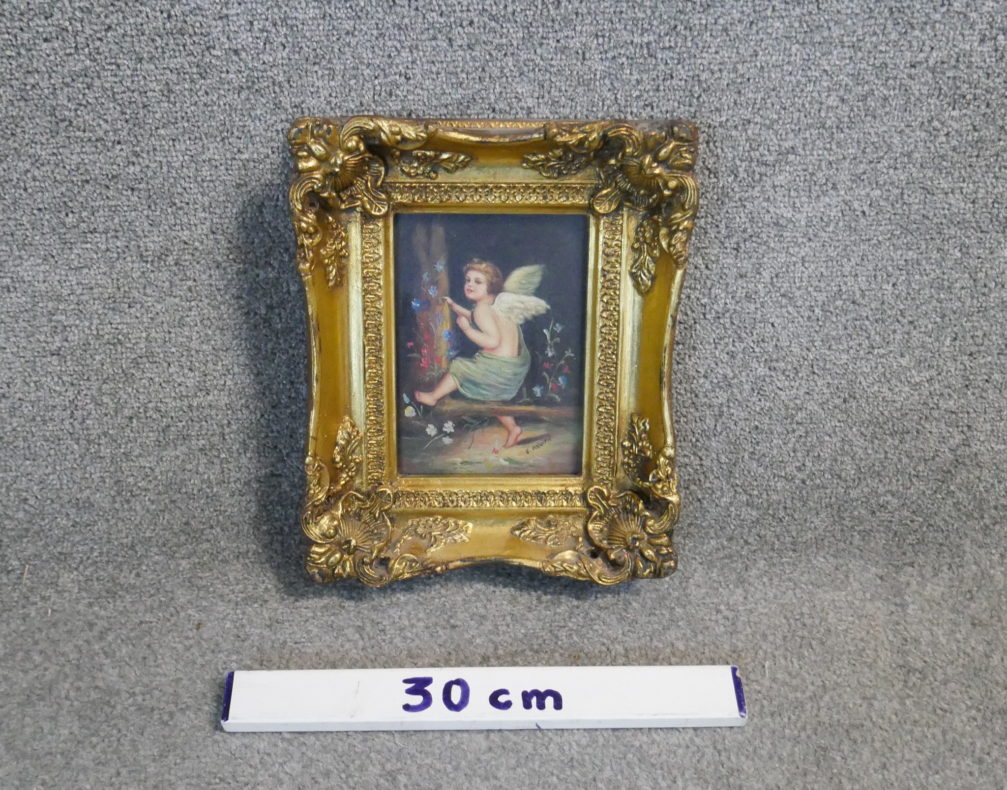 A 19th century carved gilt framed oil on board of a winged putti sitting in a wood with flowers. - Image 3 of 5