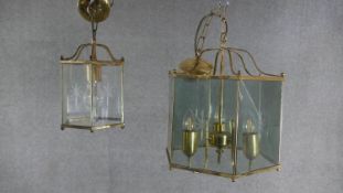 Two Victorian style brass and glass hexagonal lanterns with etched star motifs. One with four