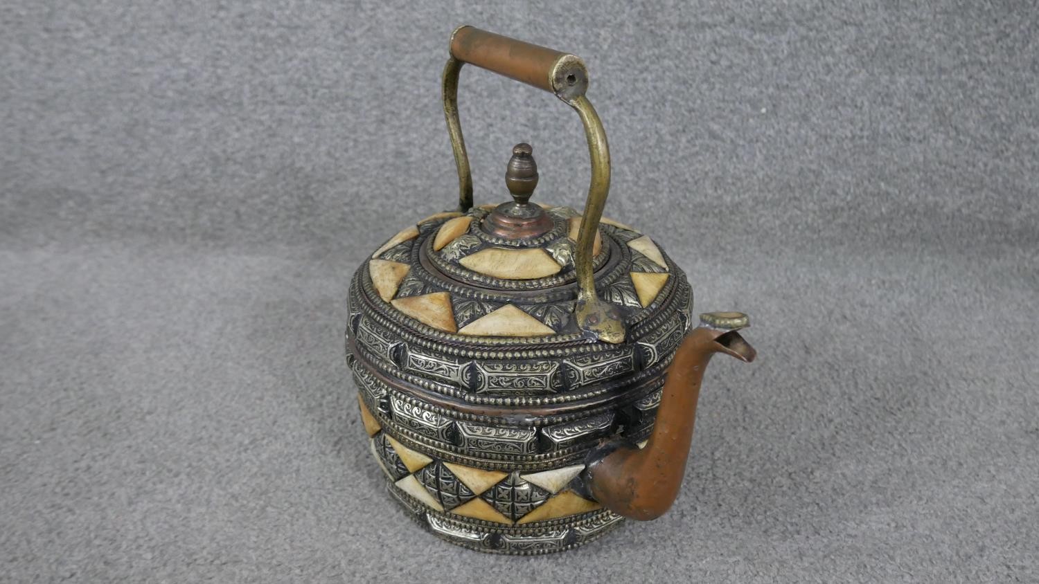 A Moroccan copper, bone and white metal kettle with geometric design. (leaks) H.30 W.28cm - Image 2 of 5