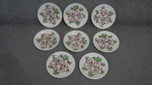 A set of eight hand painted Camelia engraving plates by Johnson Brothers. Makers mark to the back.