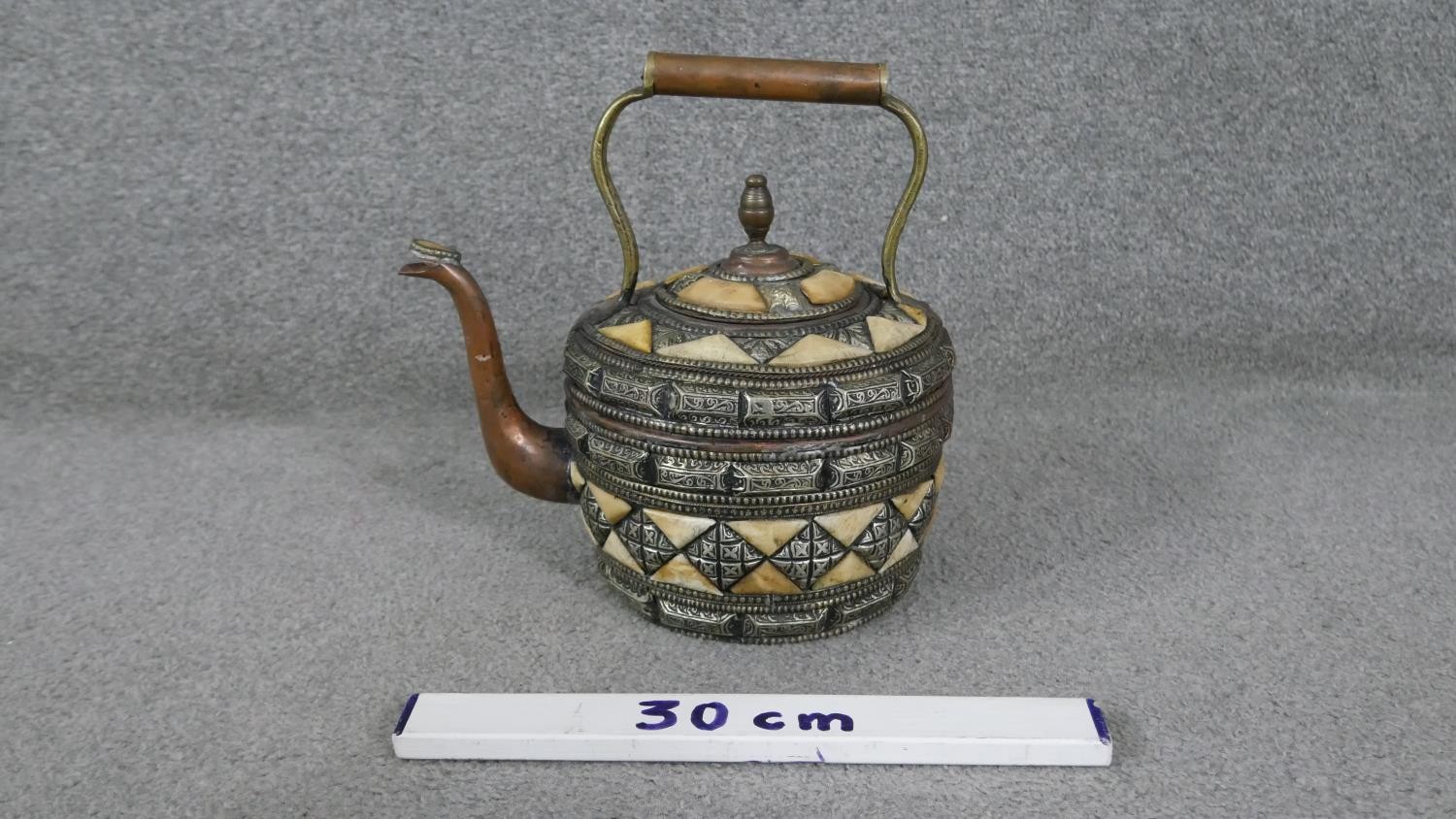 A Moroccan copper, bone and white metal kettle with geometric design. (leaks) H.30 W.28cm - Image 5 of 5